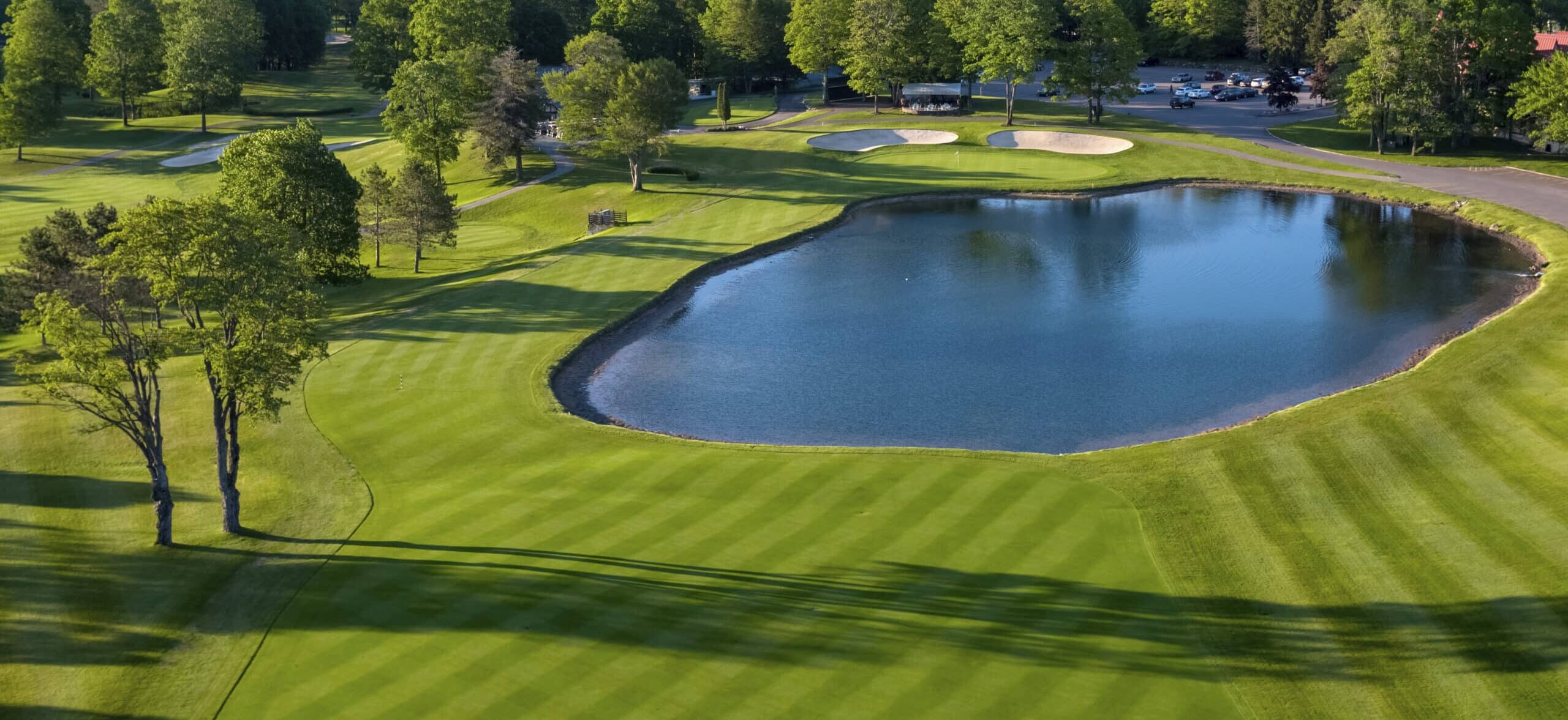 The Heather Golf Course in Northern Michigan with green fairways and blue lakes